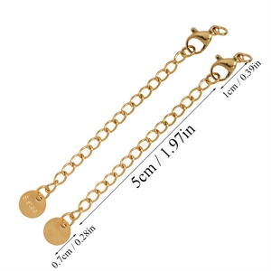 Detailed view of 5cm gold stainless steel extender chains with lobster clasp and tag