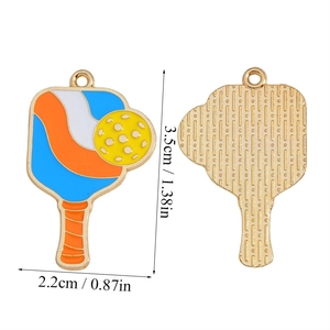 Detail showing front and back of pickleball paddle enamel charms with size dimensions