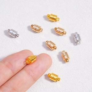 Cylindrical magnetic clasps for DIY jewelry in gold and silver finish on white background
