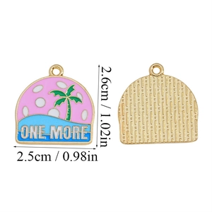 Macro view of semi-circular tropical charm with ONE MORE text and 2.6cm size detail