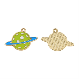 Detail view of green enamel planet charms with blue rings and golden alloy textures