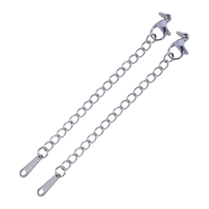 Macro shot of silver stainless steel extender chains with lobster clasps and steel tags