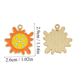 Front and back view of pickleball floral alloy charm with measurements 2.9cm by 2.6cm