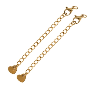 Detail of golden stainless steel extender chains with lobster clasp and heart tag