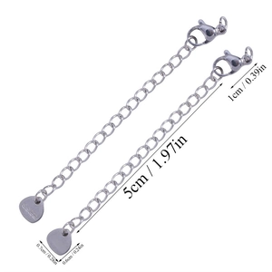Detail of stainless steel extender chains with lobster clasp and heart pendant engraved S.steel