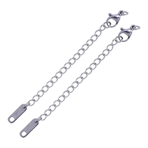 Detailed macro view of stainless steel extension chains with lobster clasp and s.steel tag