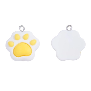 Detailed view of yellow and white resin cat paw pendants for DIY jewelry and keychain crafts