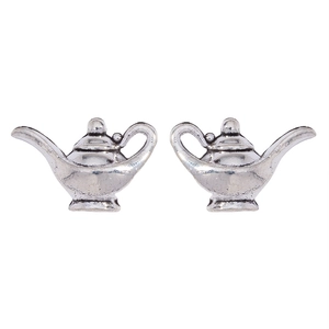 Detail of vintage silver teapot pendants for DIY jewelry making and earrings