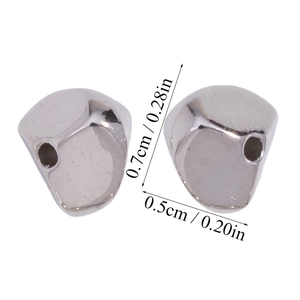 Detail view of irregular silver CCB spacer beads showing 0.7cm by 0.5cm dimensions