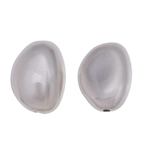 Detailed view of irregular streamlined silver metal earrings with mirror polished finish