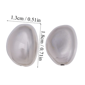 Macro view of silver liquid metal style pebble earrings with size 1.3cm by 1.8cm