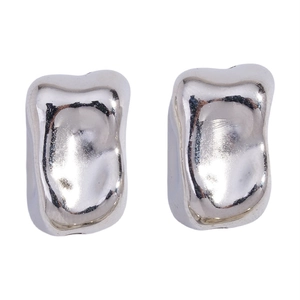 Detailed macro view of irregular liquid silver studs with high gloss metallic finish