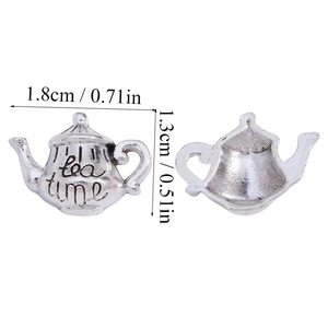 Macro view of 1.8cm silver alloy teapot pendant showing 'tea time' engraving and size details