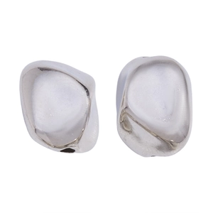Macro detail of silver liquid metal earrings with irregular textured surface design