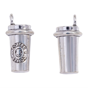 Detailed macro view of coffee cup metal charms with coffee text and smiley face design