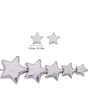 Macro detail of silver star-shaped CCB beads with 0.6cm diameter for DIY jewelry making