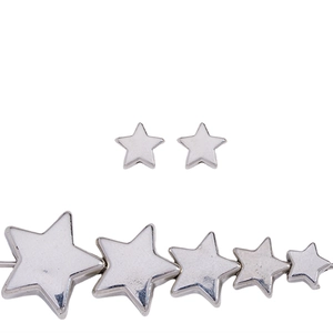 Macro detail of silver star-shaped CCB beads in various sizes for DIY jewelry making
