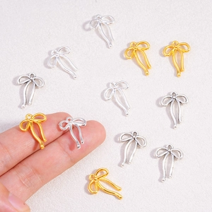 Elegantes colgantes de lazo en oro y plata para creación de joyas DIY y manualidades