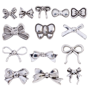 Set van 13 vintage zilveren strikkralen van legering voor DIY sieraden en handwerkprojecten