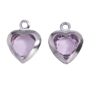 Macro view of light purple heart-shaped glass pendants with polished silver steel frames
