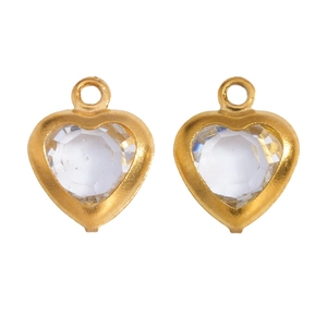 Close-up of heart glass pendants with gold metal frames for DIY jewelry making