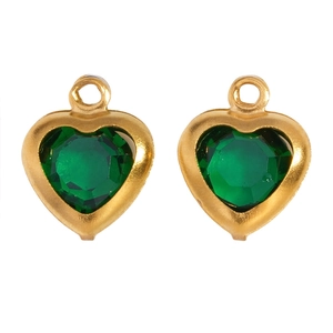 Macro detail of emerald green heart-shaped glass pendants with gold plated metal borders