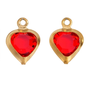 Detail of red heart-shaped glass pendants with gold-plated metal frames for DIY jewelry