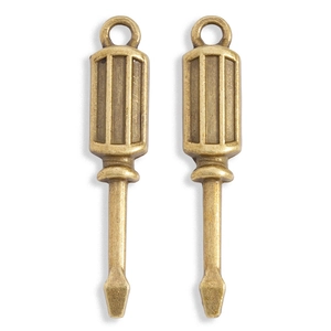 Detailed view of vintage bronze alloy screwdriver charms for DIY jewelry making