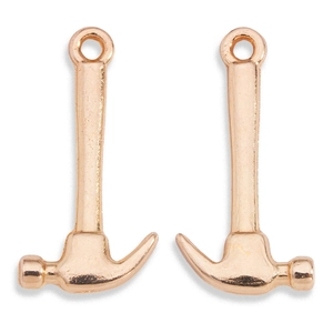 Macro shot of rose gold hammer pendants for jewelry making and DIY crafts