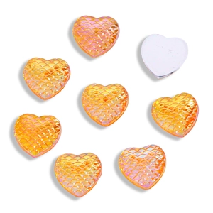 Detail showing 12mm orange heart resin cabochons with iridescent mermaid fish scale texture
