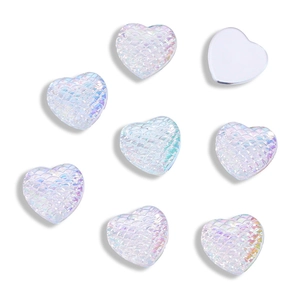 Macro detail of 12mm heart shaped fish scale acrylic cabochons with iridescent pearl finish