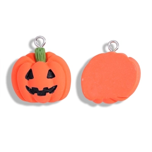 Front and back view of orange resin pumpkin pendants for Halloween jewelry making