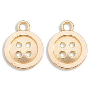 Macro detail van twee gouden legering knophangers voor DIY sieraden maken