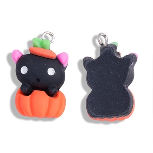 Front and back detail of a resin Halloween black cat in pumpkin pendant for DIY jewelry