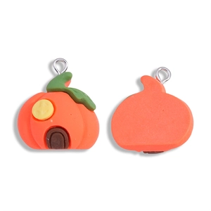 Front and back views of a resin pumpkin house charm for Halloween DIY jewelry making
