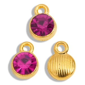 Detailed view of round gold alloy pendant with rose red gemstone and striped metal back