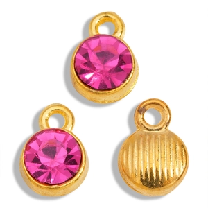 Detailed view of hot pink rhinestone charms with gold metal base and textured back