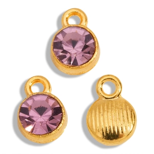Macro detail of purple rhinestone pendants with golden base and striped back textures