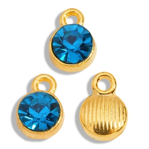 Detail of sapphire blue rhinestone pendants with gold alloy base and textured back finish