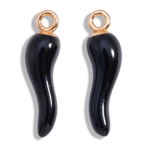 Macro shot of 2 black chili pepper charms with gold rings for DIY jewelry making