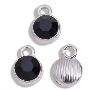 Macro view of round black rhinestone charms with silver alloy base for DIY jewelry