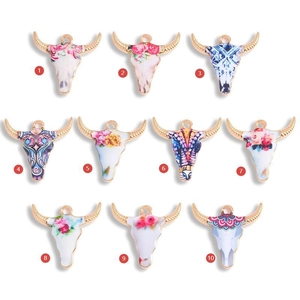 Set van 10 kleurrijke bull head bedeltjes met bloemenpatronen en goudkleurige rand