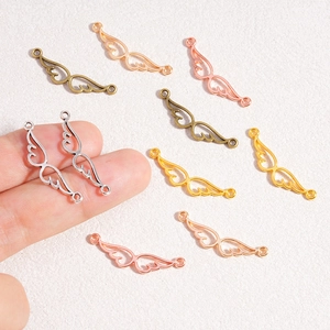 Hollow alloy wing charms for DIY jewelry making in gold silver and bronze colors