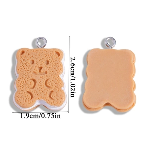 Front and back view of a bear cookie resin charm with dimensions 2.6cm by 1.9cm