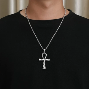 Vintage Egyptian Ankh cross necklace in silver stainless steel worn by a male model