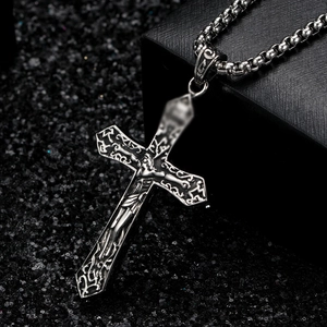 Vintage stainless steel cross necklace with Jesus relief and ornate floral engravings