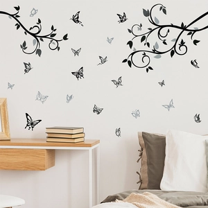 Black tree branch wall decals with 20 butterflies silhouetted for bedroom decor