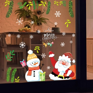 Detail of Christmas window clings featuring Santa, snowman and snowflakes on glass