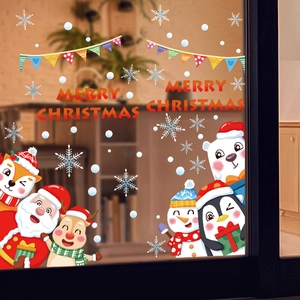 Dettaglio adesivi natalizi con Babbo Natale, renne e scritta Merry Christmas