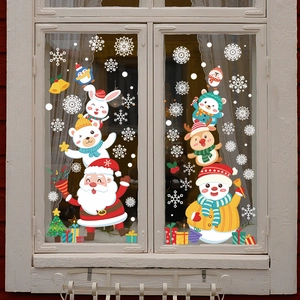 Detailed view of Christmas Santa and Reindeer static window stickers on a glass frame